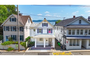 RIVERFRONT RETREAT Nestled in the heart of the highly sought after village of Piermont, this picturesque home offers an idyllic lifestyle with captivating views of the majestic Hudson River.