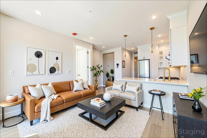 Living room featuring light wood-style flooring and recessed lighting