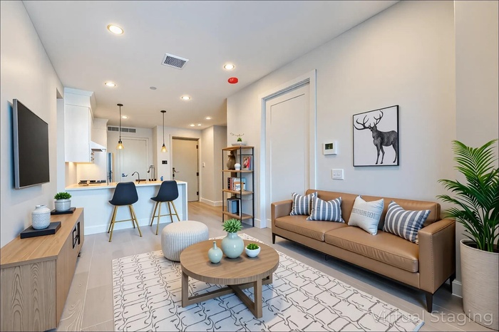 Living area featuring recessed lighting and baseboards