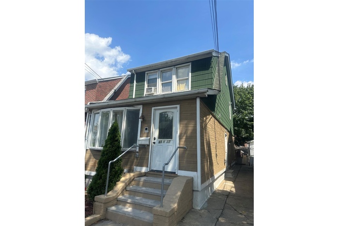 Traditional home with entry steps and brick siding