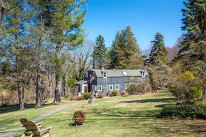 Set on a quiet, scenic road in the prestigious Quaker Hill area, this home offers the perfect blend of seclusion and accessibility.