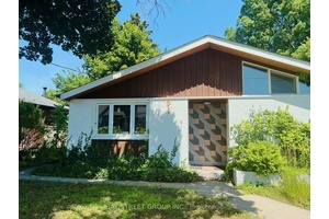 Unit 1 of the unique legal non conforming above ground side by side duplex for lease.
