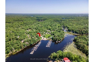 Enjoy breathtaking marina views from your lakeview windows and expansive covered deck overlooking North Honey Harbour Bay.