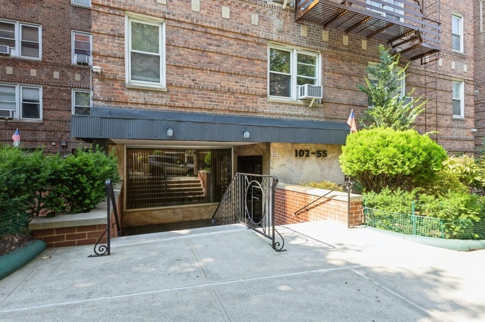 View of exterior entry with brick siding