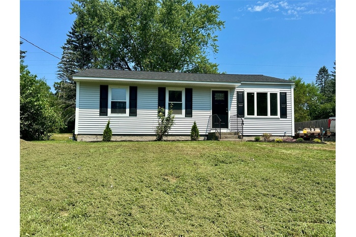 Single story home featuring a front lawn, entry steps, and roof with shingles