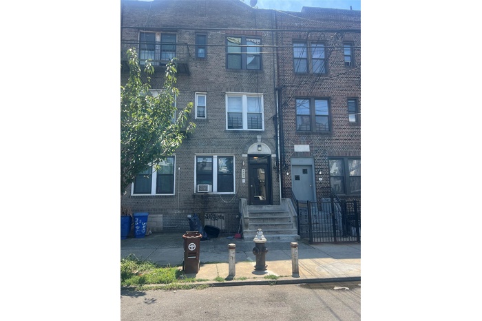 View of front of home featuring brick siding