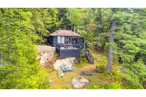 WATER ACCESS ONLY Nestled along the idyllic shores of Kushog Lake, this quintessential water access only cottage retreat awaits.