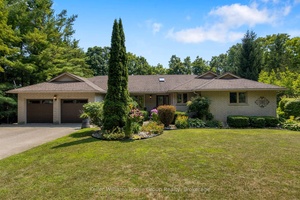 Nestled on 1. 25 acres in charming Salem, this serene brick bungalow offers the perfect blend of privacy and convenience.