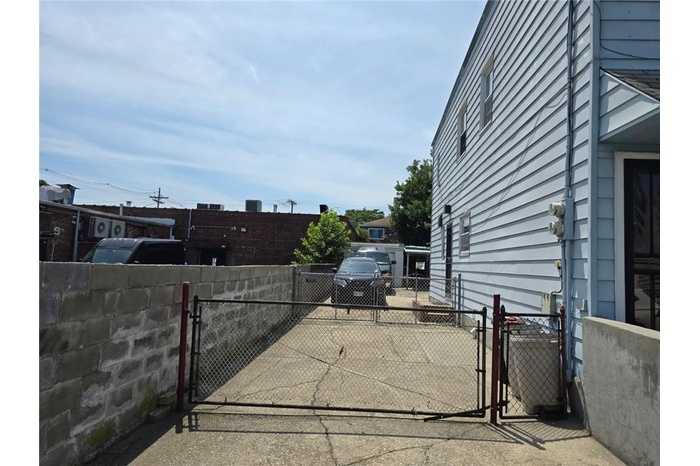 View of patio / terrace with fence and a gate