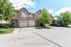 Absolutely Gorgeous Executive Townhome In Desirable Glen Abbey.