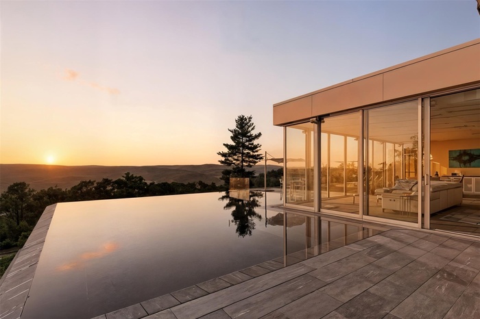 Welcome to Infinity Ridge Retreat, where California meets Upatate New York. Sleek modern design and modern amenities nestled on the rustic mountain wi