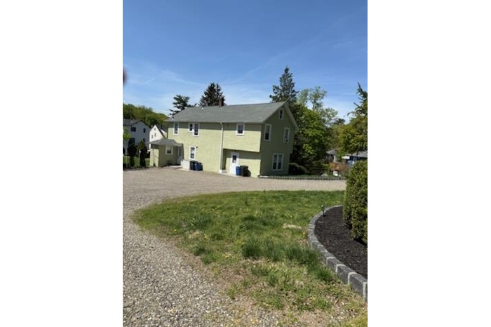 Rear view of house featuring stucco siding