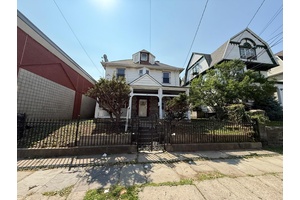 Nestled in the heart of vibrant downtown Yonkers, this commanding white Colonial offers a rare opportunity to own a piece of vintage charm with endless potential.