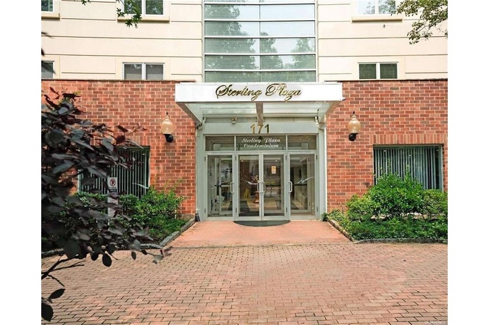 Entrance to property featuring french doors and brick siding