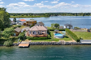 Welcome to 33 Tuttle Point Road a stunning waterfront bungalow that offers the ultimate St.