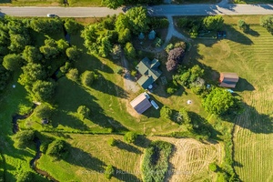 Nestled just minutes from Hwy 401 amp ; the charming village of Grafton, this self sufficient 9 acre property features a custom square log home offering 3, 500 sq.