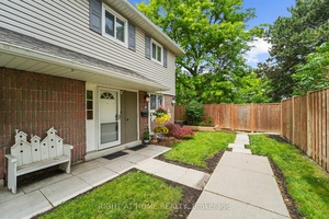 Charming End Unit Townhome in Peel Village A Private Backyard Oasis Awaits !