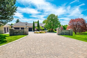 A Must Have for Sports Enthusiasts Previously Owned by Legendary Canadian Hockey Goaltender Curtis Joseph Welcome to this stunning executive bungalow nestled on nearly 2 acres in the prestigious enclave ...