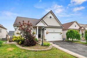 Welcome to this Beautiful Bungalow offering 3 spacious bedrooms on the main level PLUS 2 additional bedrooms in the fully finished walk out basement !