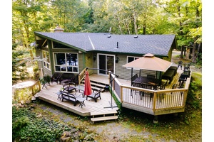 Experience the ultimate in lakeside living at this serene cottage retreat on Soyers Lake, part of a picturesque 5 lake chain offering miles of boating.