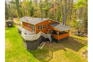 Discover your serene oasis on the breathtaking banks of the Skootamatta River with this charming 4 season recreational property, offering 164 feet of south facing waterfront on.