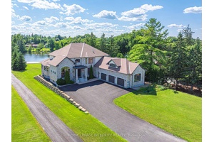 Perched along the serene Rideau River, this magnificent Italian style villa seamlessly blends timeless elegance with modern luxury.