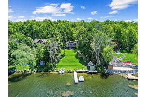 This stunning family residence beautifully combines luxury and serenity, situated upon a hill with views of the Trent River.