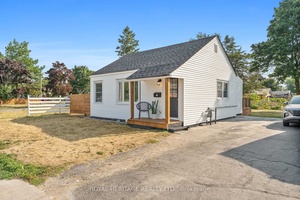 Welcome to this beautifully renovated 2 bedroom, 2 bathroom bungalow that has been completely rebuilt from the studs up.