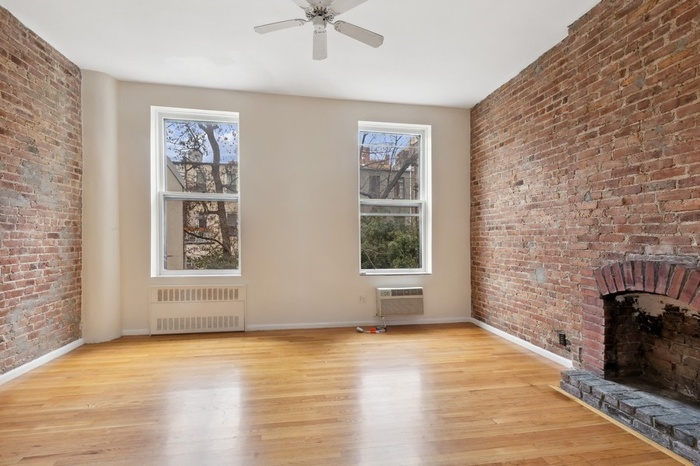Bedroom with brick wall detail