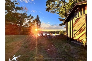 Welcome to 250 Younge Lane, a charming waterfront cottage on beautiful spring fed White Lake, offering the ideal setting for relaxation and outdoor enjoyment.