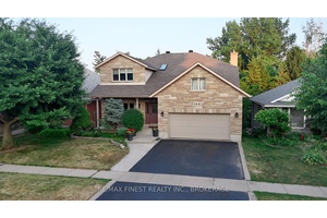 Prime West End Gem Backing Onto Private Green Space !