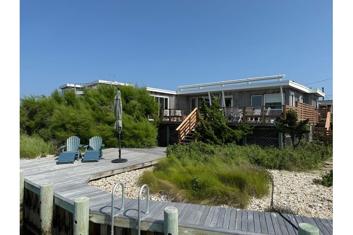 Back of property with a wooden deck