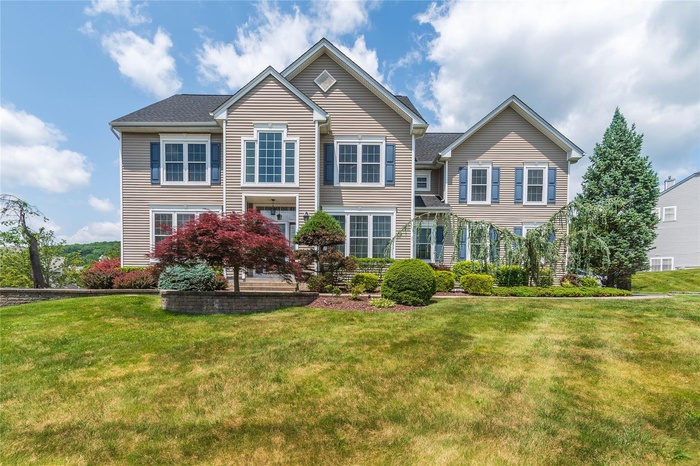 View of front of house with a front lawn