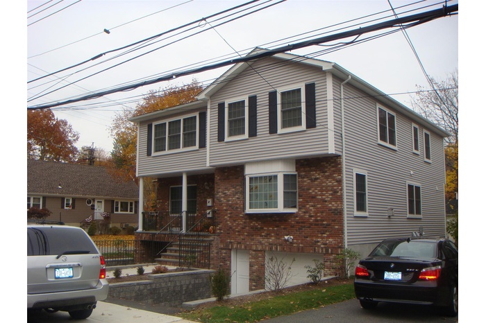 View of front of home featuring brick siding