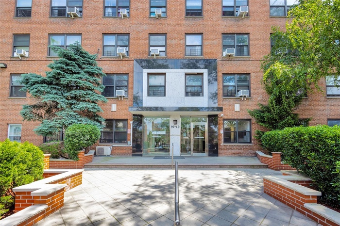 View of apartment building / complex with cooling unit and central AC unit