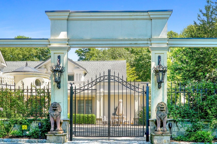 View of gate featuring fence