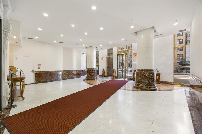 Community lobby featuring recessed lighting