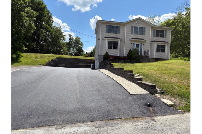 View of front of property with a front lawn