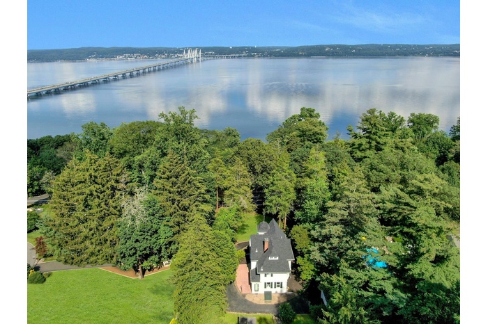 Bird's eye view of a nearby body of water and a notable bridge