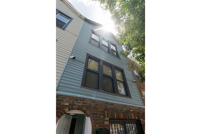 View of property exterior featuring stone siding