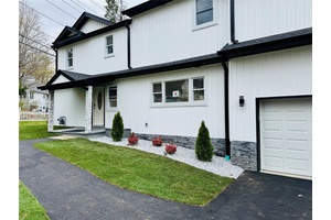 Spacious new construction 4 bedroom, 3 bathroom farmhouse colonial featuring modern finishes and classic charm.