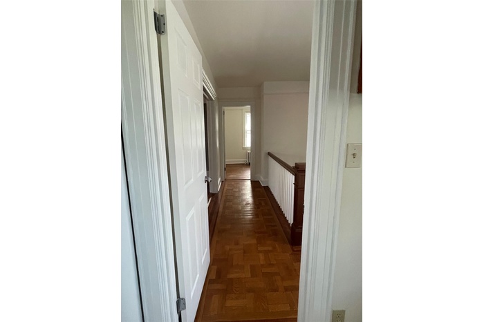 Hallway featuring baseboards