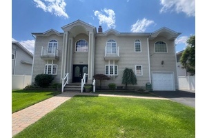 Beautiful Redone Center Hall Colonial This house has 4 5 Bedrooms with 5 full bathrooms, new plumbing, new electric, all new windows.