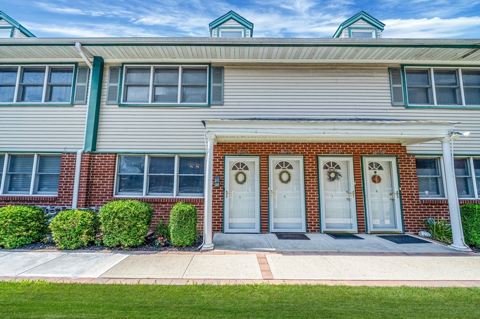 View of front facade featuring brick siding