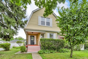 BRIGHT, CHARMING colonial with larger than usual backyard for this neighborhood.