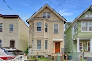 Freestanding 2 Family, Colonial Style dwelling on dead end street, having plenty of yard space, full basement, versatile layout and exceptional potential.