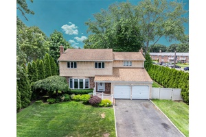 Welcome to 50 Wildwood Ave a beautifully maintained Colonial in the award winning Half Hollow Hills School District !