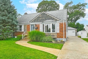 CAPE COD HOME LOCATED ON QUIET BLOCK IN DESIRABLE N.