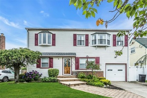 Spacious Bright Expanded Cape in East Meadow Schools.