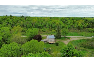 Tucked away on a quiet municipally maintained road, this 3 bedroom, 1 bathroom home sits on a sprawling 3.
